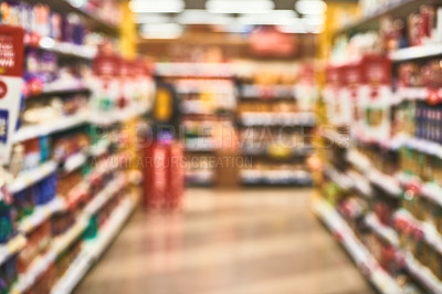 Buy stock photo Blur, grocery store and aisle of supermarket, goods display and shelves with merchandise for purchase. Food, packaging and shop for options on offer, retail presentation and rack for organization