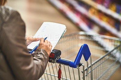 Buy stock photo Hands, person and shopping list at grocery store with wheel cart for foods, products and prices. Closeup, customer and supermarket or convenience shop for retail cost, sale and discount or promotion