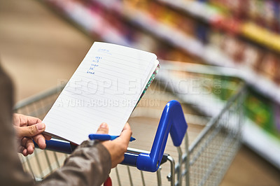 Buy stock photo Hands, person and shopping list at grocery shop with wheel cart for foods, products and prices. Closeup, customer and supermarket or convenience store for retail cost, sale and discount or promotion