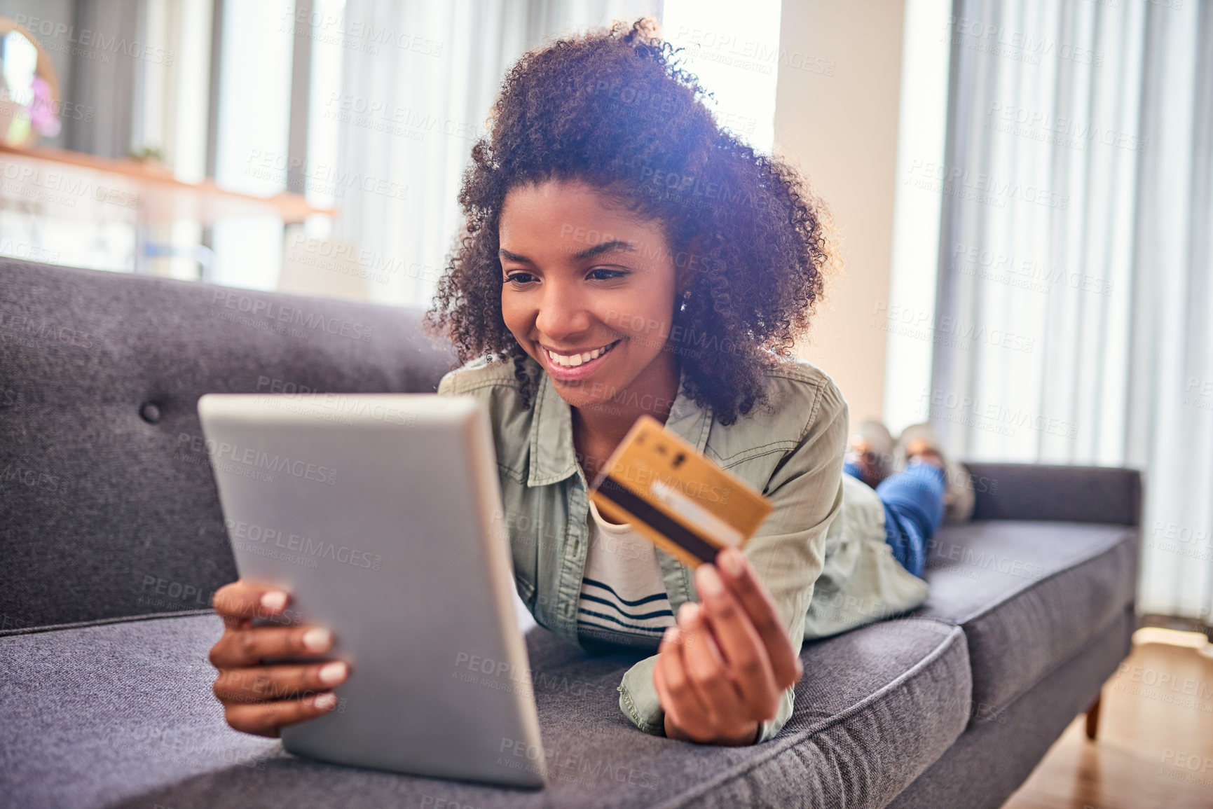 Buy stock photo Black woman, sofa and excited on tablet with credit card for online shopping, payment and saving plan. Living room, smile and happy at home for internet banking, budget and investment with finance