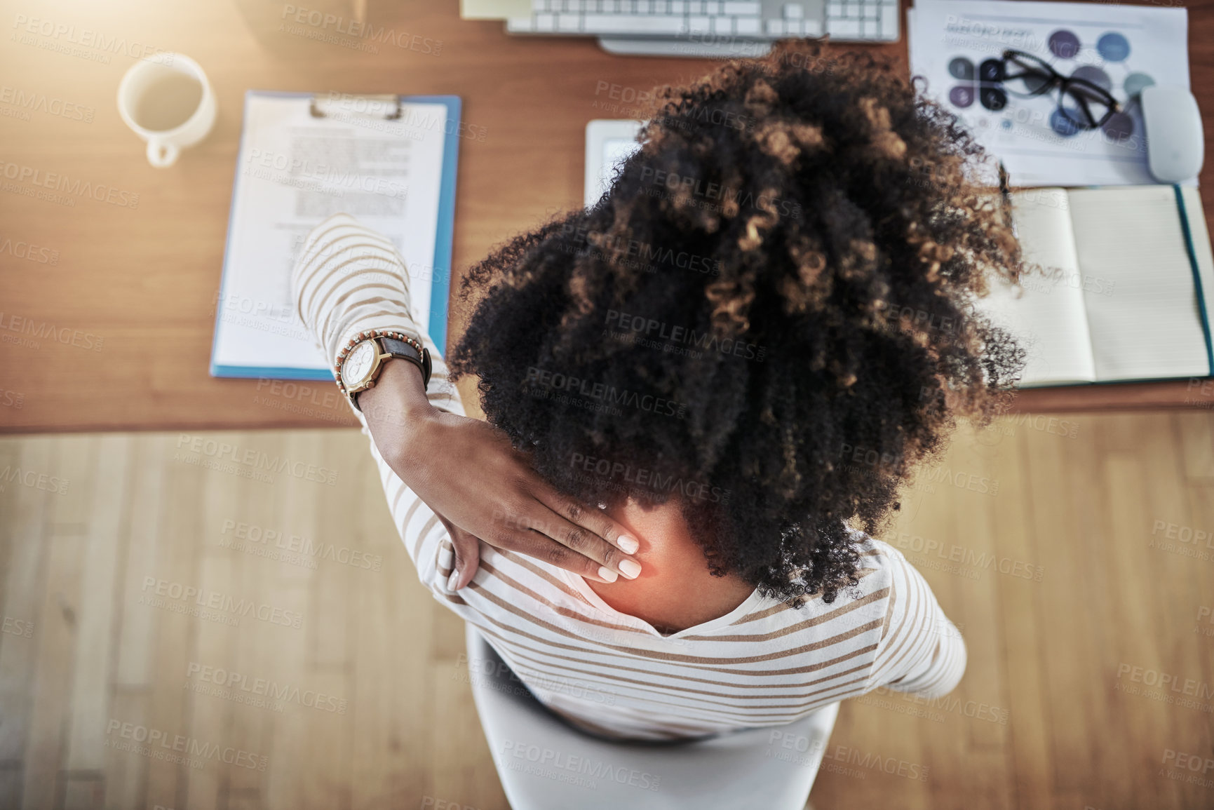 Buy stock photo Rearview shot of a young woman experiencing neck pain while working at home