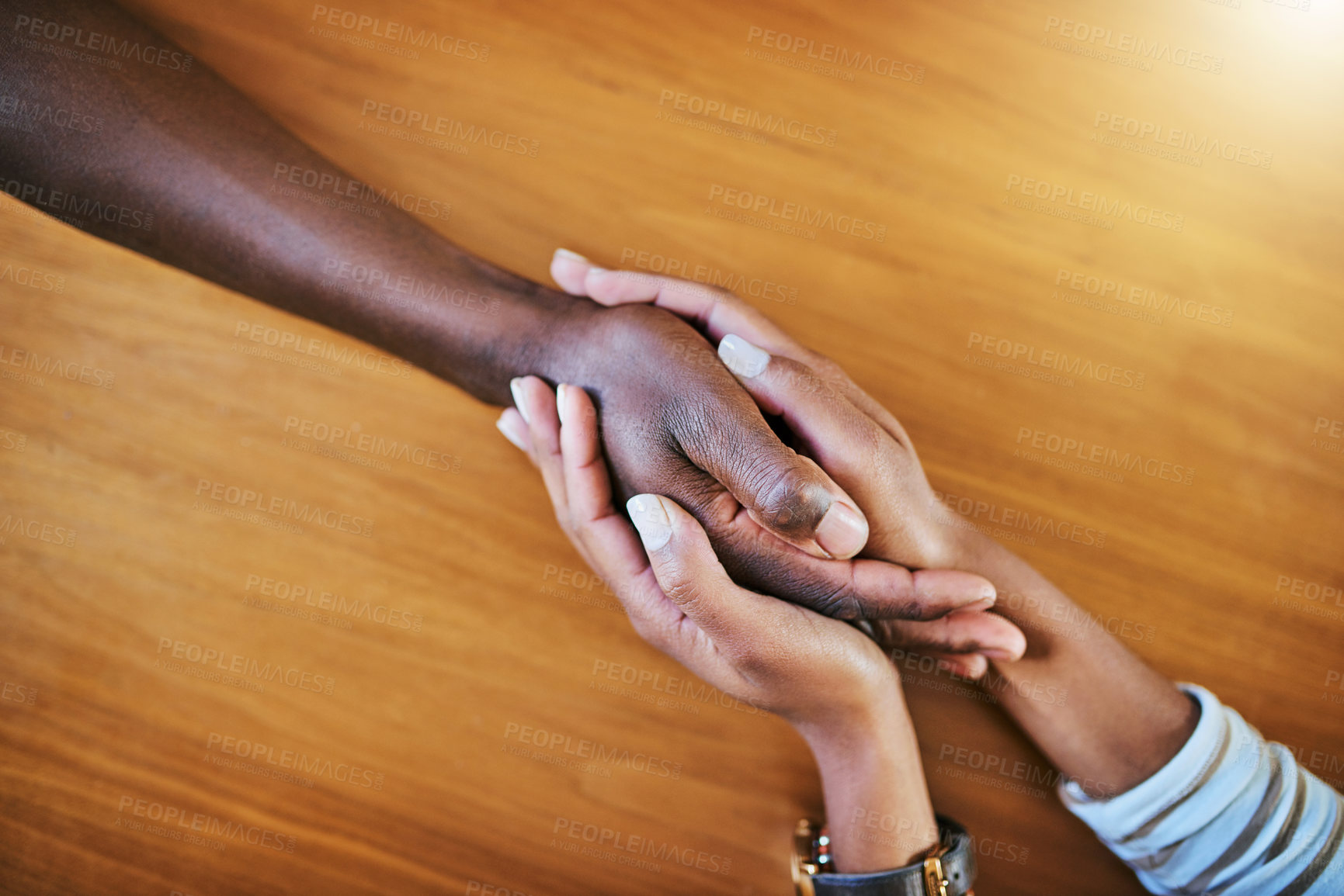 Buy stock photo Holding hands, people and empathy in home for support, comfort and kindness with trust, care and help. Couple, love and above solidarity for mental health, connection or compassion with commitment