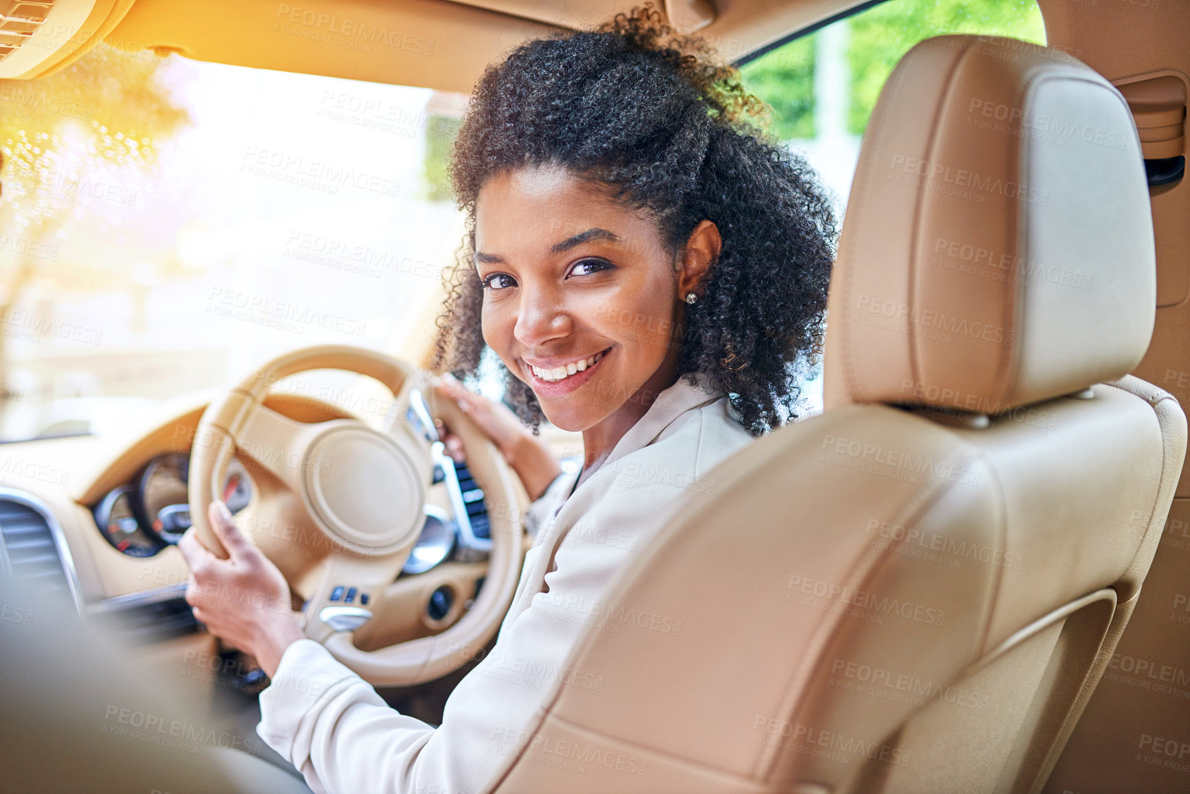 Buy stock photo Cropped portrait of an attractive young businesswoman driving to work on her morning commute