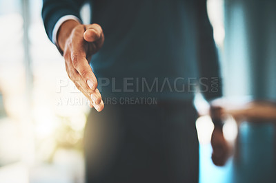 Buy stock photo Cropped shot of a businessman extending his arm for a handshake
