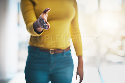 Buy stock photo Cropped shot of a businesswoman extending her arm for a handshake