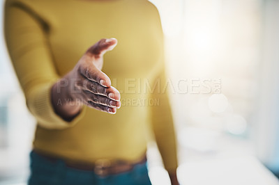Buy stock photo Cropped shot of a businesswoman extending her arm for a handshake