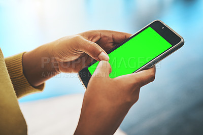 Buy stock photo Cropped shot of a businesswoman using a mobile phone in an office