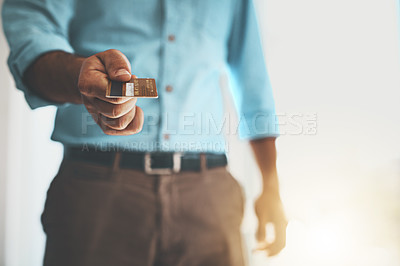 Buy stock photo Cropped shot of a businessman holding a credit card