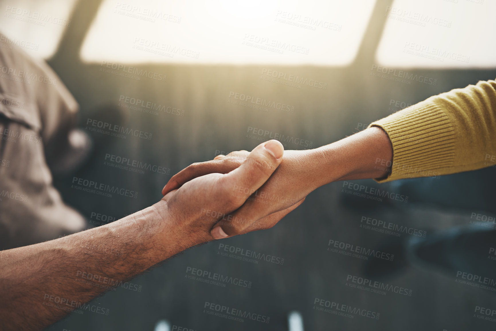 Buy stock photo Cropped shot of a businessman and businesswoman shaking hands