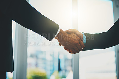 Buy stock photo Cropped shot of two businessmen shaking hands