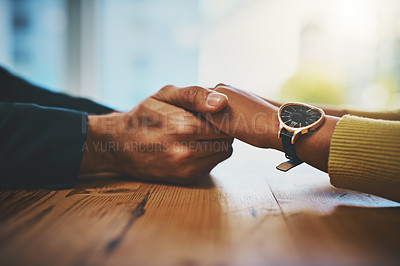 Buy stock photo Closeup, holding hands and couple with empathy, support and solidarity with comfort, forgive or grief. Zoom, man and woman with love, touching hand or gratitude with trust, help or kindness with hope
