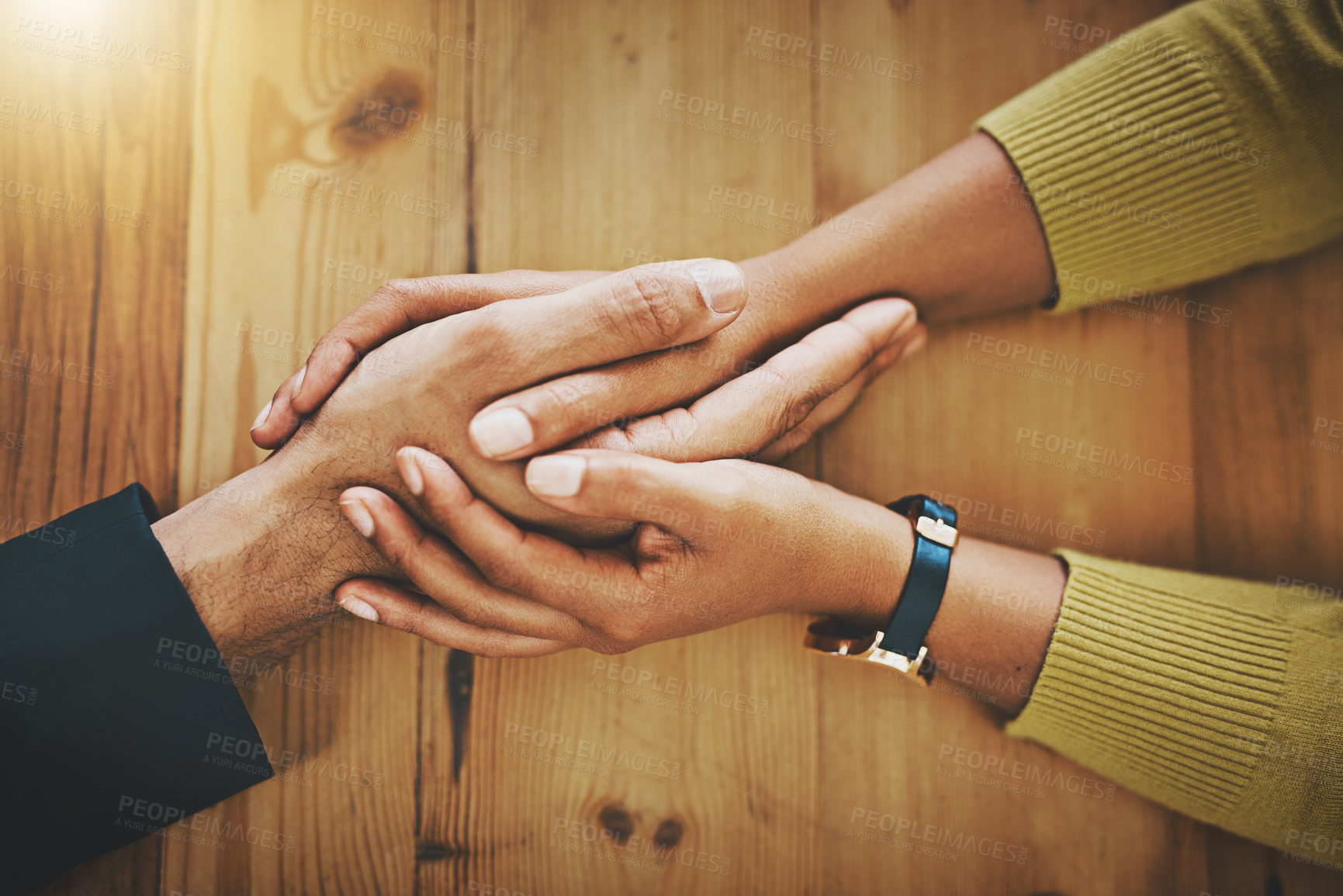 Buy stock photo Above, couple and holding hands on table in support for marriage, commitment and compassion. People, understanding and love with gesture of empathy for partnership, kindness and forgiveness at home