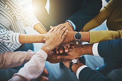 Buy stock photo Closeup shot of an unrecognizable group of businesspeople joining their hands together in a huddle