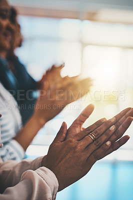 Buy stock photo Closeup shot of an unrecognizable group of businesspeople applauding in an office