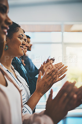 Buy stock photo Shot of a group of businesspeople applauding in an office