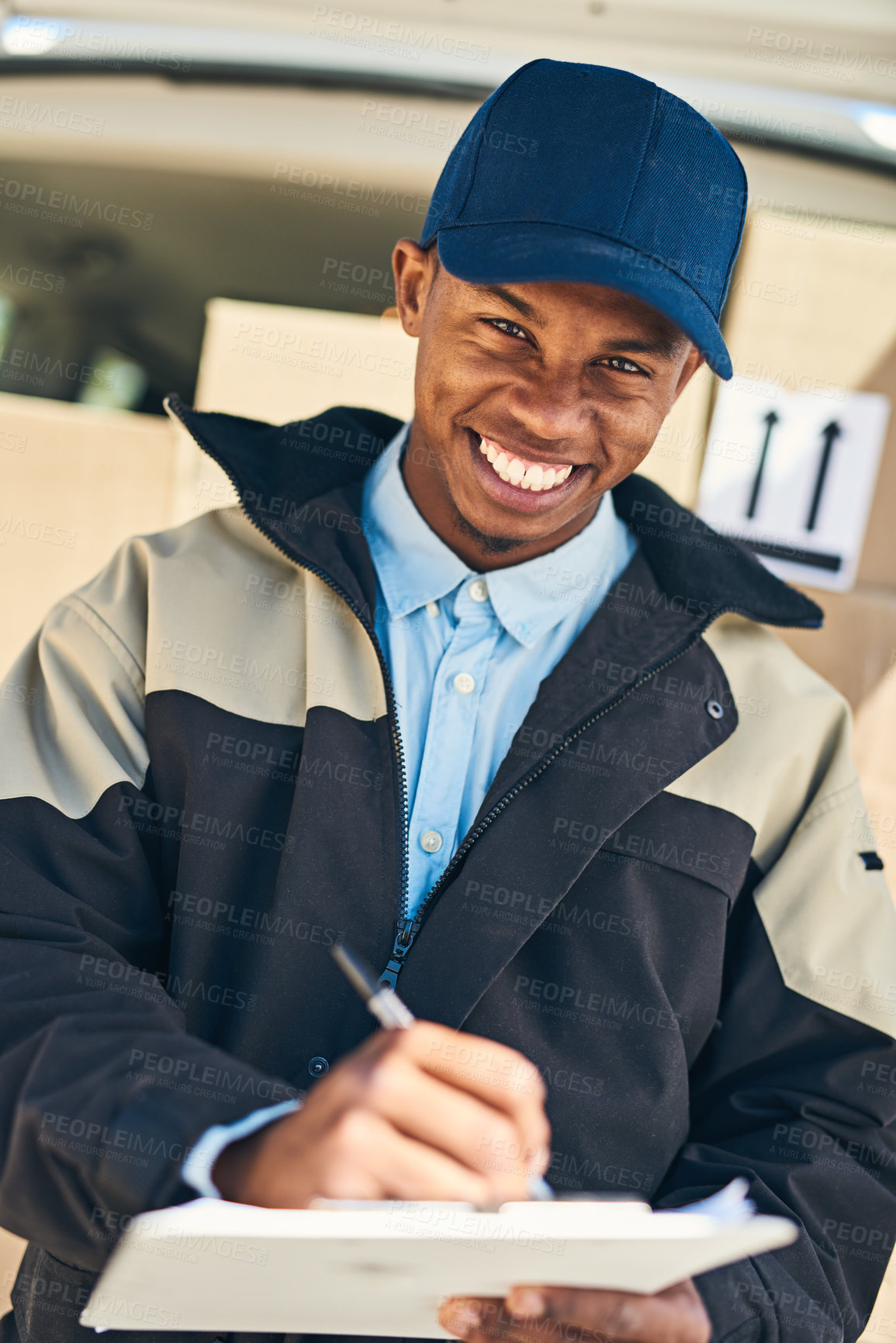 Buy stock photo Black man, portrait and writing with clipboard for delivery, checklist or supply chain in logistics. Happy African, male person or courier guy with smile for box, parcel or package service in city