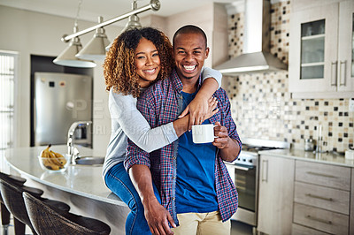 Buy stock photo Cropped portrait of an affectionate young couple in their kitchen at home