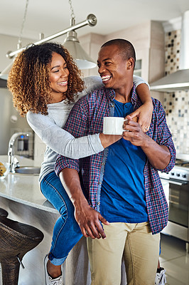 Buy stock photo Cropped shot of an affectionate young couple in their kitchen at home