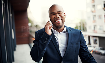 Buy stock photo Portrait of a handsome young businessman talking on a cellphone outside his office