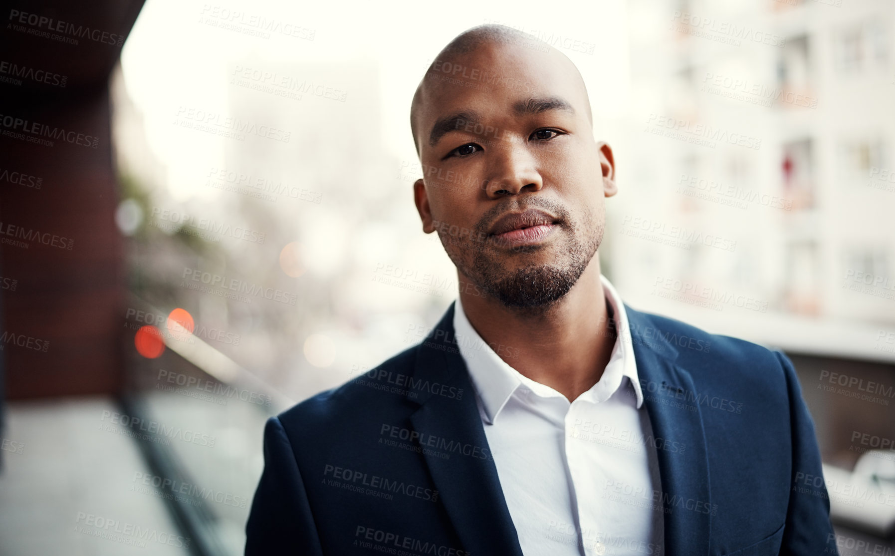 Buy stock photo Portrait of a handsome young businessman standing outside on his office balcony