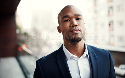 Buy stock photo Portrait of a handsome young businessman standing outside on his office balcony