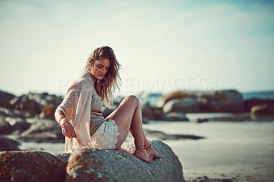 Buy stock photo Shot of an attractive young woman spending a day at the beach