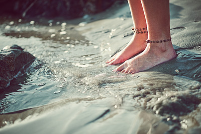 Buy stock photo Cropped shot of an unrecognizable woman at the beach