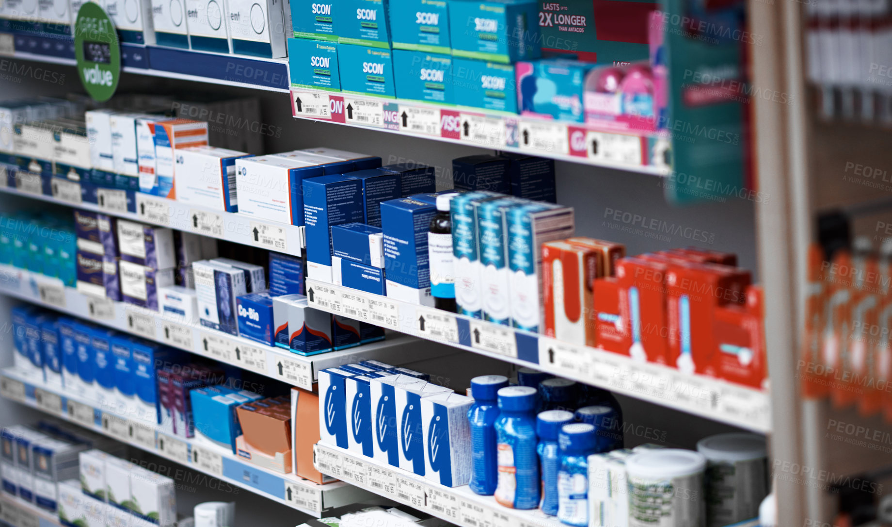 Buy stock photo Shot of shelves stocked with various medicinal products in a pharmacy