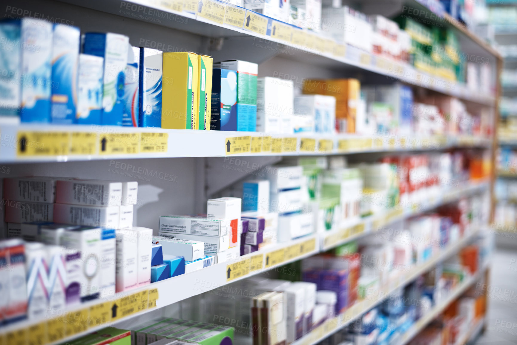 Buy stock photo Shot of shelves stocked with various medicinal products in a pharmacy