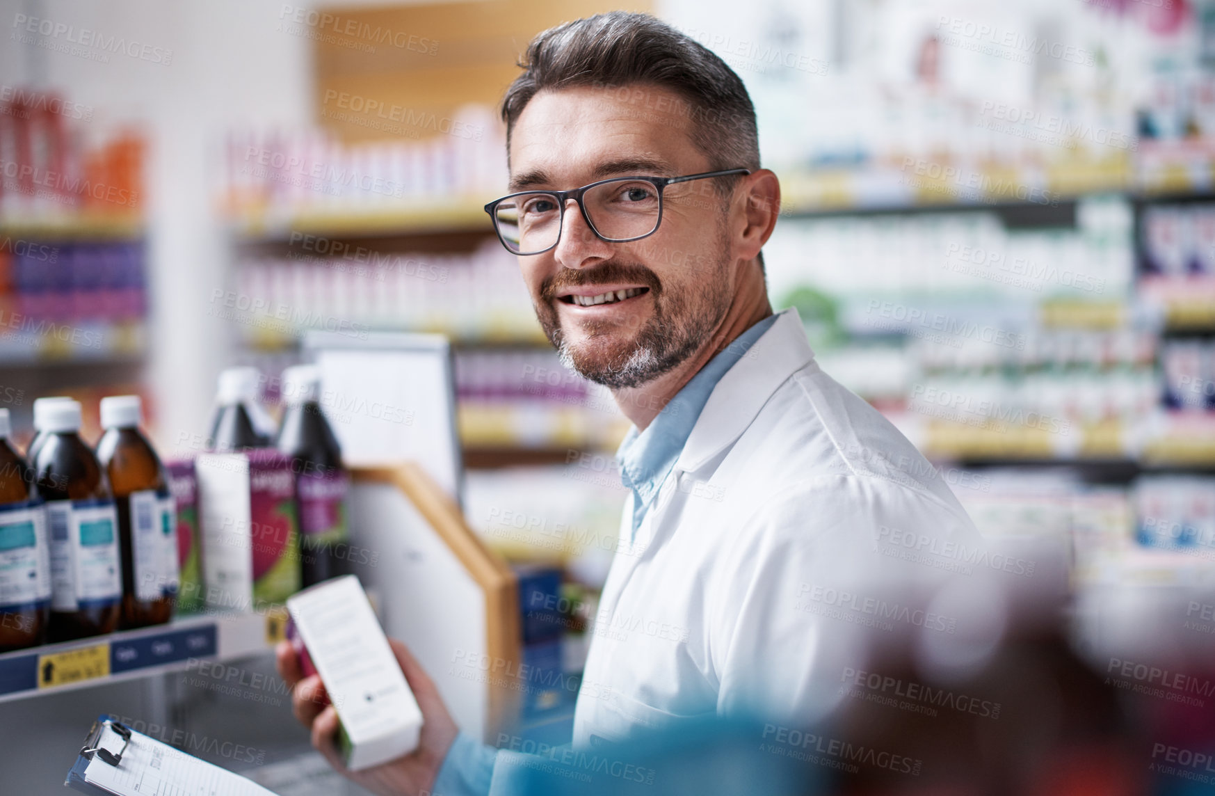 Buy stock photo Portrait of a mature pharmacist doing inventory in a pharmacy