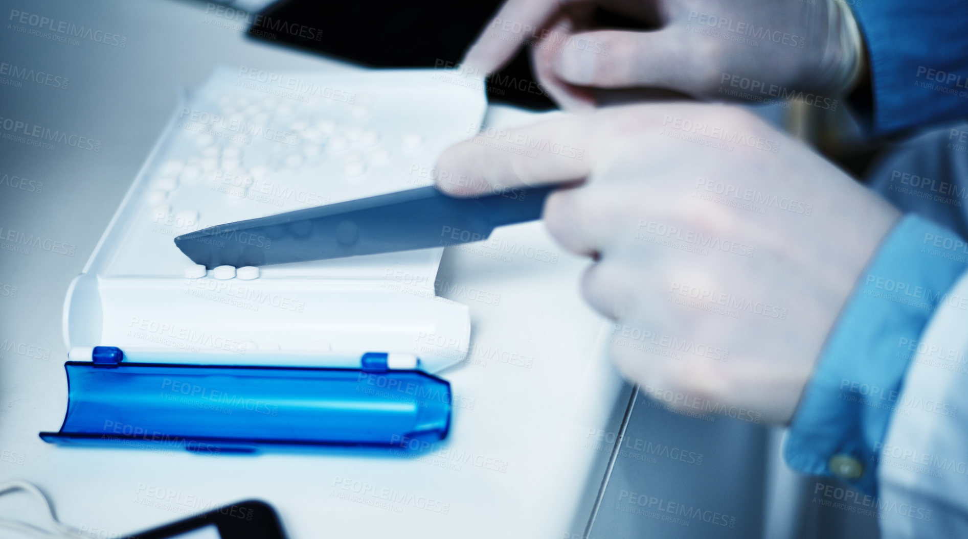 Buy stock photo Cropped shot of a pharmacist counting medication