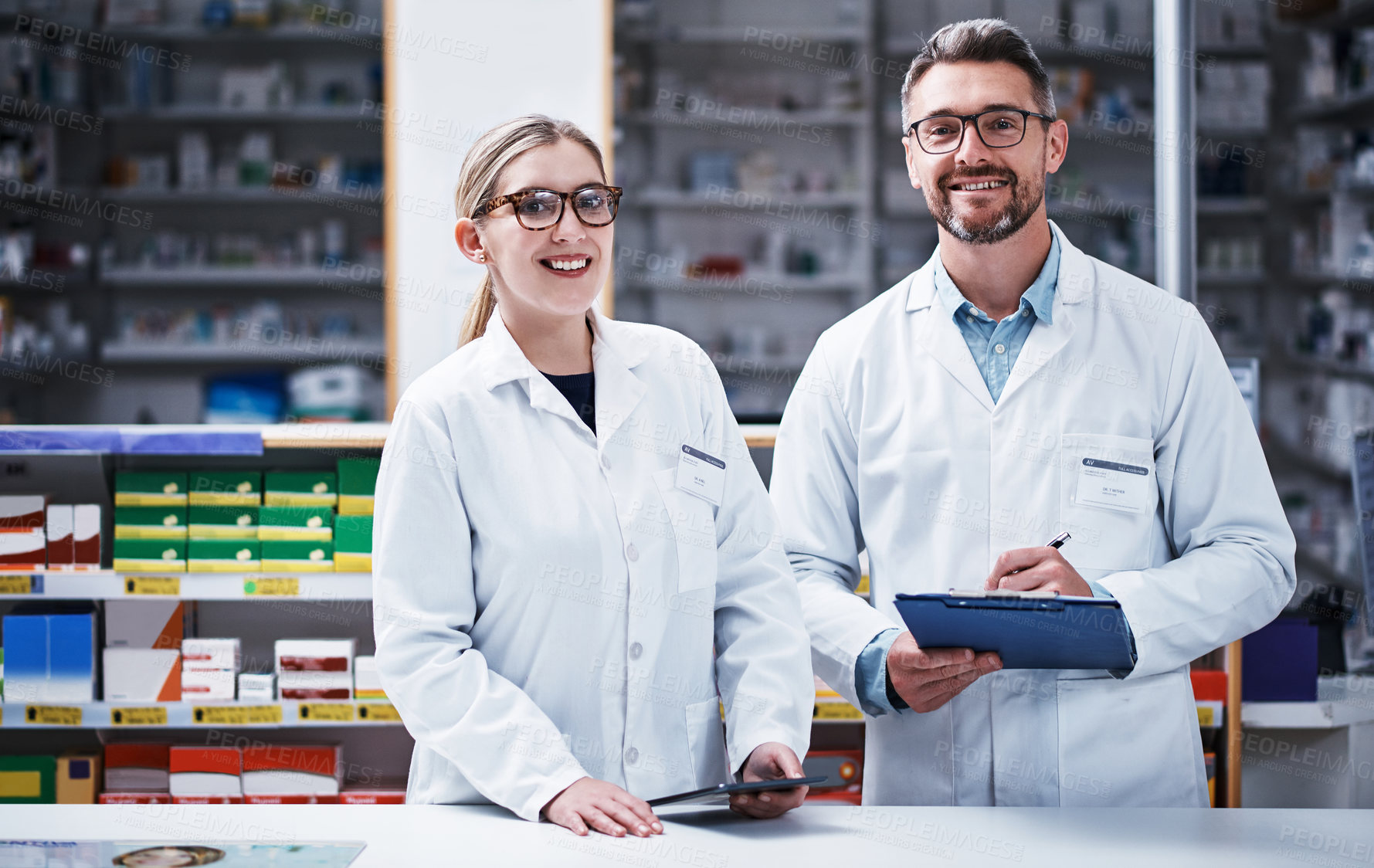 Buy stock photo Portrait of two pharmacists working in a pharmacy