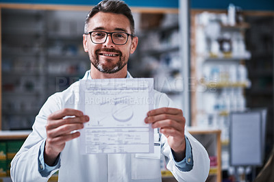 Buy stock photo Portrait of a mature pharmacist holding a page in a pharmacy