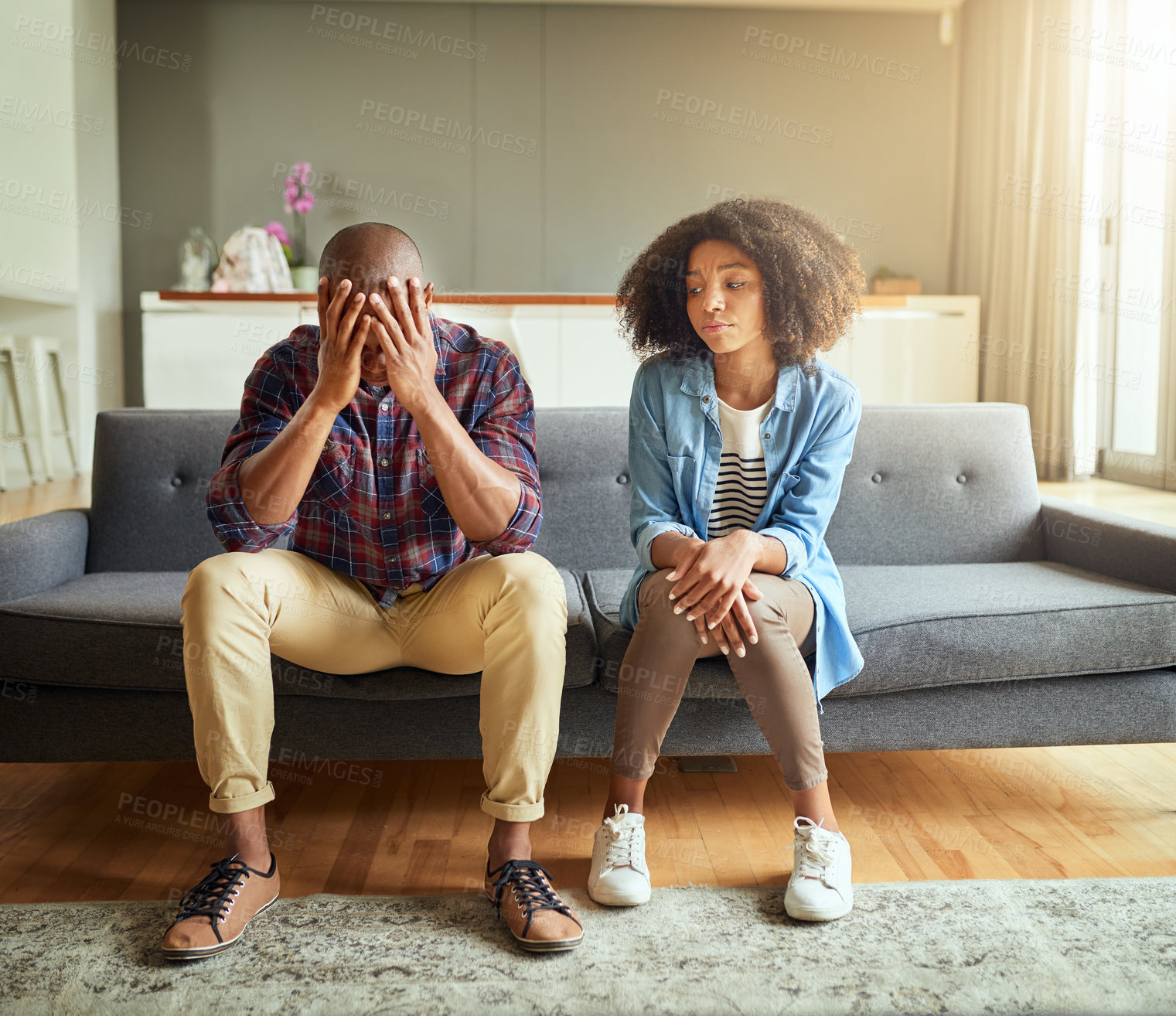 Buy stock photo Home, couple and arguing in living room on sofa for disagreement, problems and unhappy. Relationship, people and conflict or upset with confrontation at lounge on couch with regret and toxic