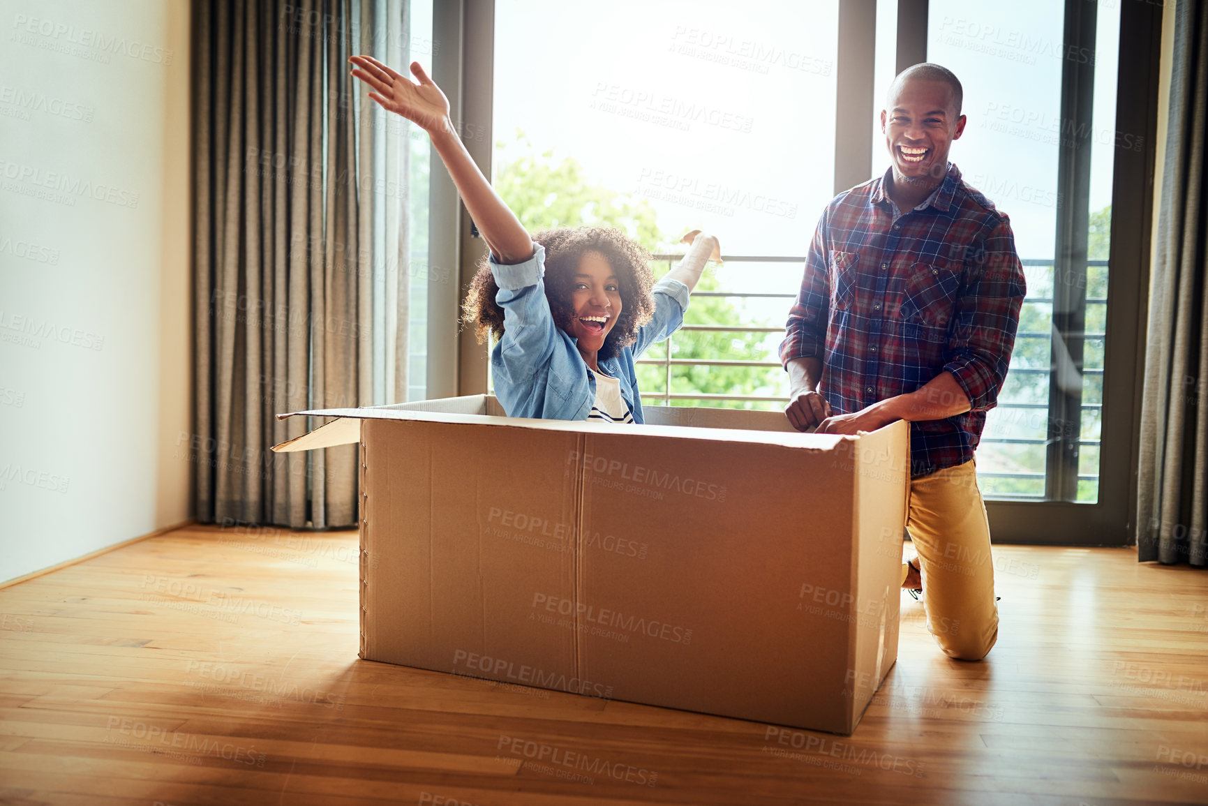 Buy stock photo Happy couple, portrait and moving with box for new home, renovation or relocation together. Black man, woman or people with smile in relax for freedom, property or ownership in apartment at house