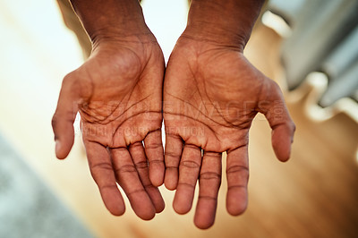 Buy stock photo Closeup of an unrecognizable person's open hands stretched out at home during the day