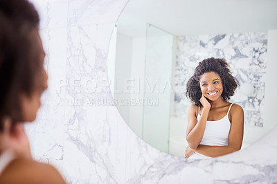 Buy stock photo Model, face and happy with skincare in mirror at apartment for wellness and healthy glow. Woman, beauty and glow for happiness in the morning with dermatology in the bathroom at hotel for self care.