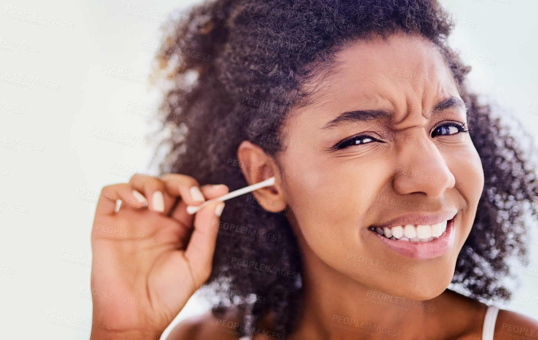 Buy stock photo Face, African woman and cotton swab for hygiene on portrait with self care and cleaning. Female person, home and removing earwax for germs, dirt and bacteria for wellness, routine and grooming