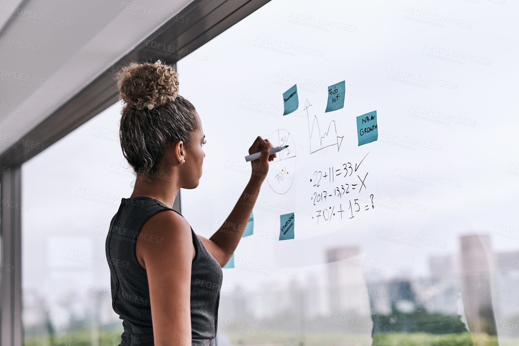 Buy stock photo Creative, brainstorming and business woman writing on glass for planning, strategy and mission in office. Idea, management and female person with sticky note for growth, development and solution 