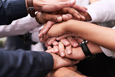 Buy stock photo Closeup shot of an unrecognizable group of businesspeople joining their hands in a huddle