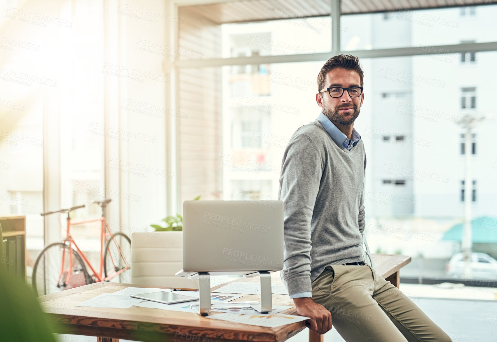 Buy stock photo Portrait, business and man in office, smile and laptop with confidence, career ambition and pride. Face, person and professional with startup, glasses and entrepreneur with clear vision and internet