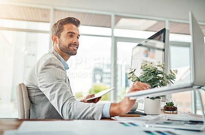 Buy stock photo Business, man and laptop with tablet in office for investment news, economy research or company shares management. Multitasking, asset manager or smile with technology at desk for online stock trends