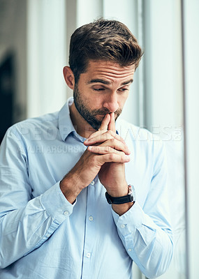 Buy stock photo Businessman, thinking and leaning with window for business decision, choice or doubt at office. Young, thoughtful man or employee in wonder or contemplating ideas for reflection, dream or opportunity