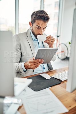 Buy stock photo Businessman, tablet and drinking with coffee for morning, research or checking schedule at office. Young, man or financial analyst with technology, caffeine or cappuccino for agenda or statistics