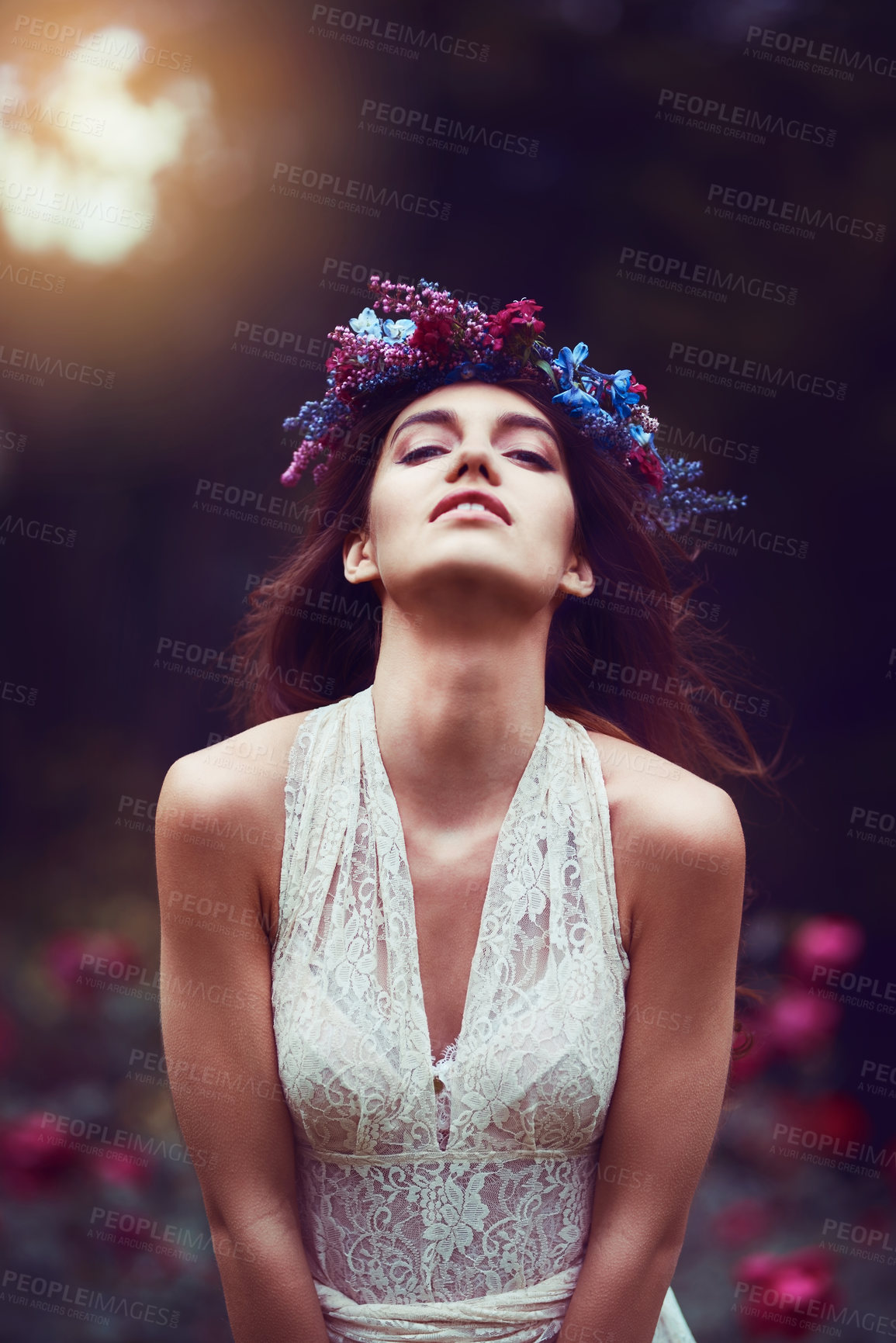 Buy stock photo Portrait of a beautiful young woman wearing a floral head wreath outdoors