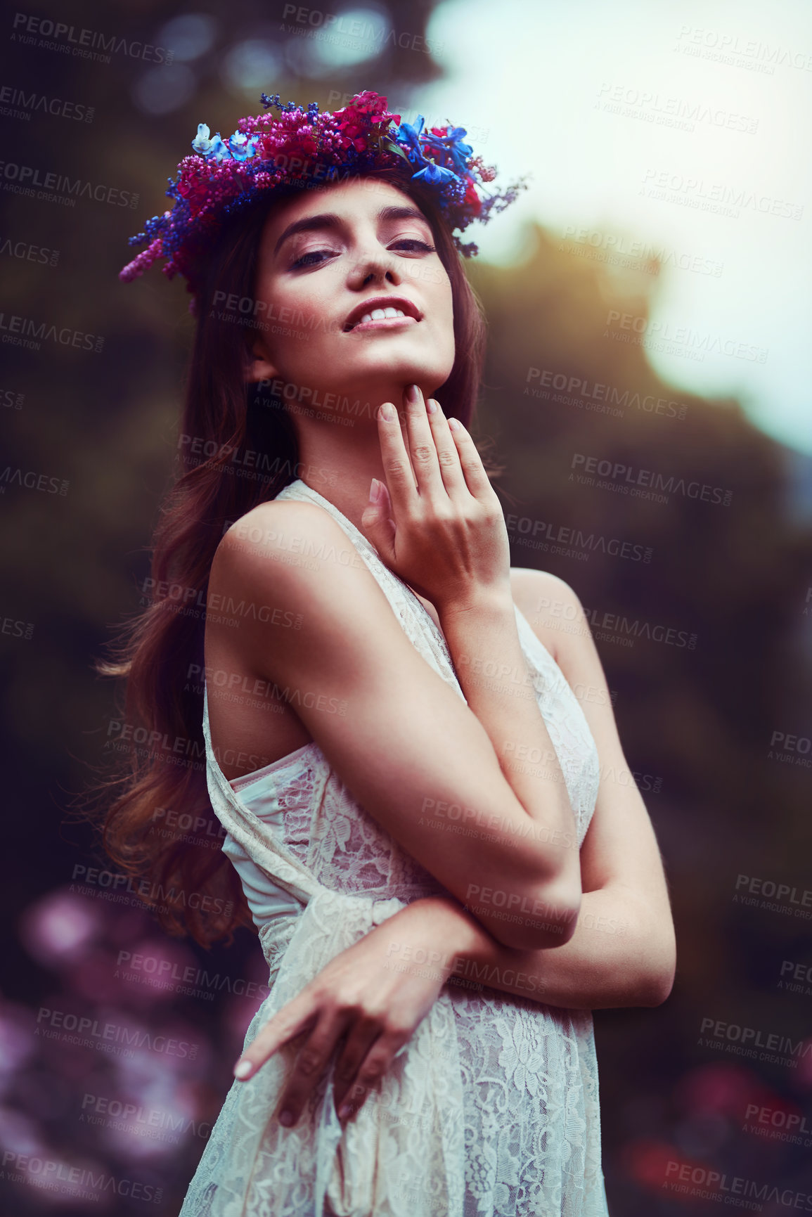 Buy stock photo Portrait of a beautiful young woman wearing a floral head wreath outdoors