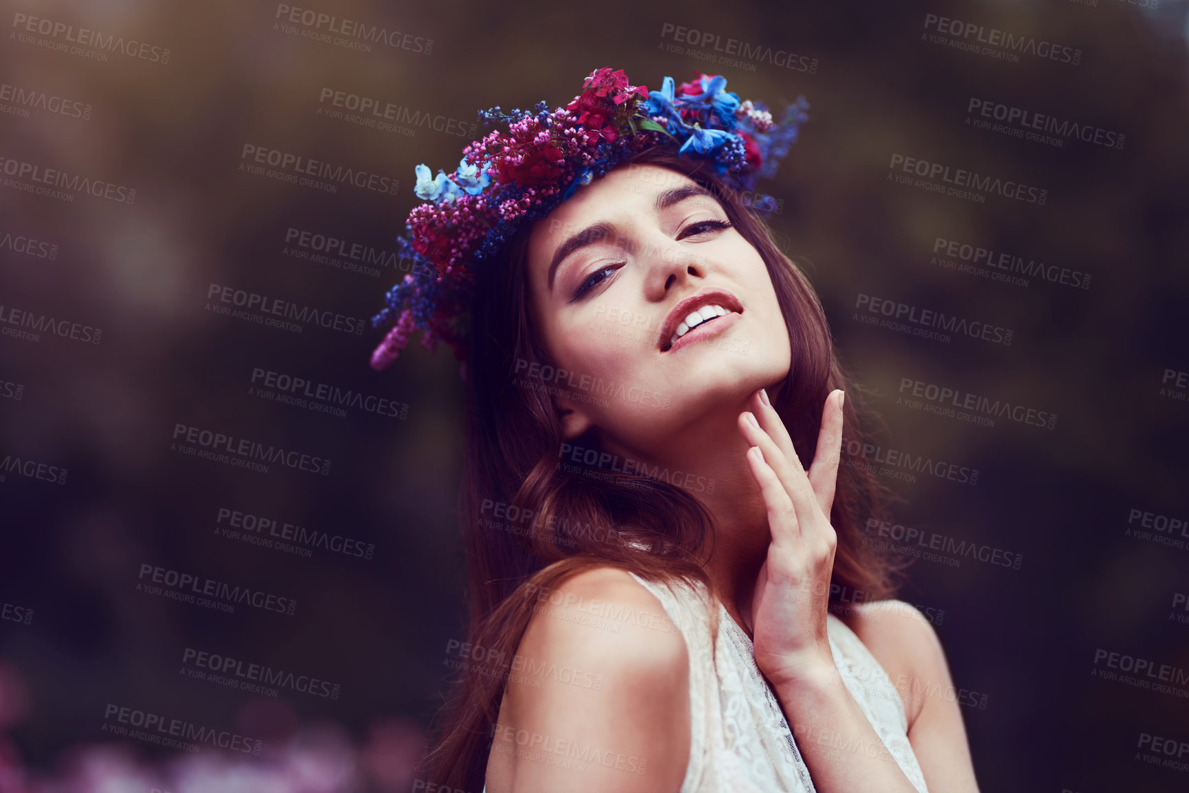 Buy stock photo Portrait of a beautiful young woman wearing a floral head wreath outdoors