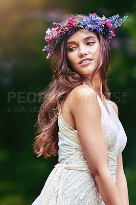 Buy stock photo Cropped shot of a beautiful young woman posing in nature