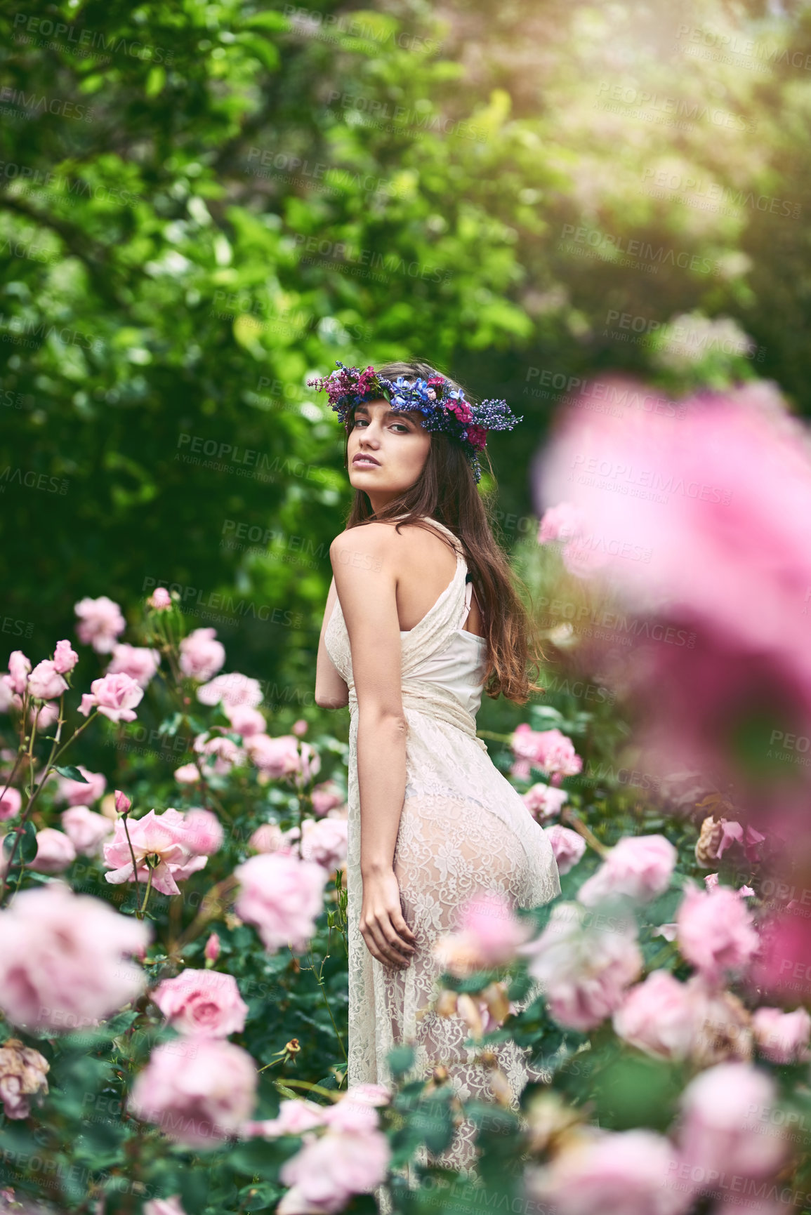 Buy stock photo Woman, portrait and garden rose with fantasy, fairytale and flowers in hair with confidence outdoor. Spring, park and crown in forest and woods with beauty, natural and sustainable style in nature 