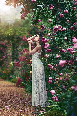 Buy stock photo Shot of a beautiful young woman posing in nature
